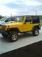 lifted yellow jeep.jpg